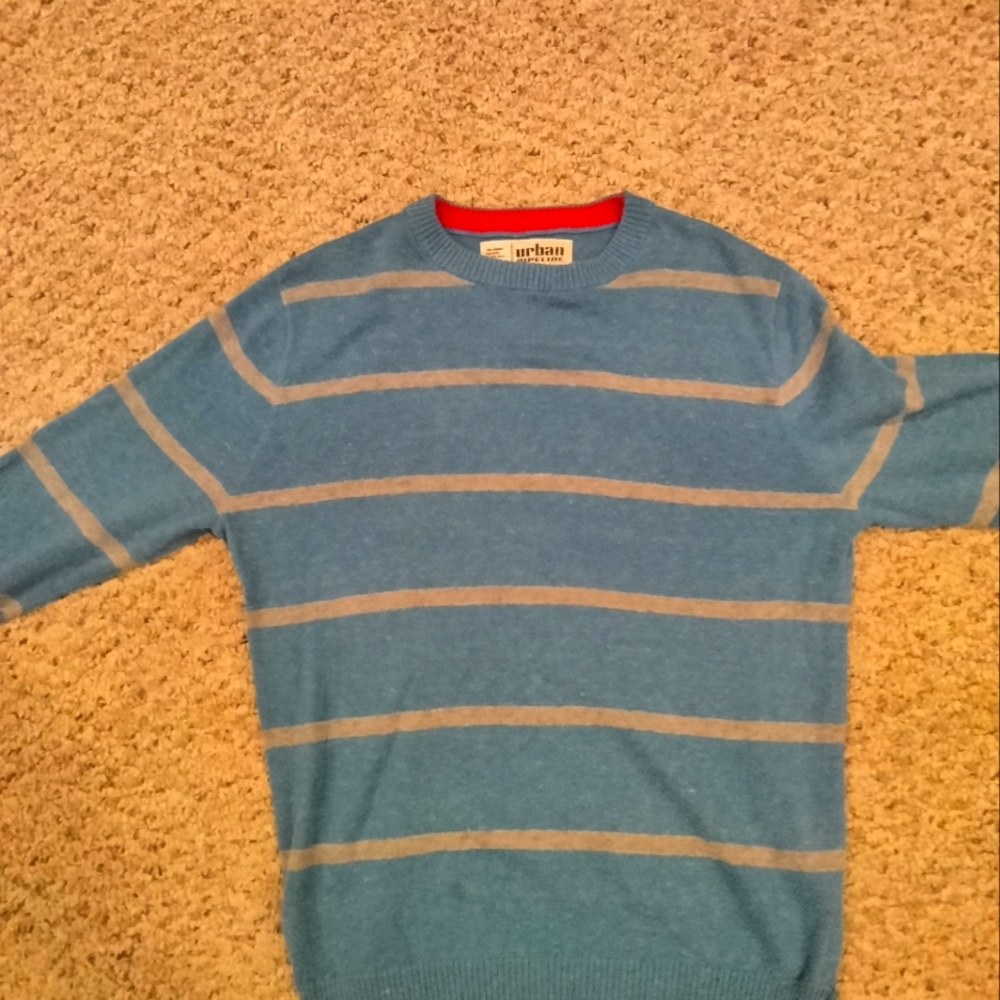 A small blue and grey sweater